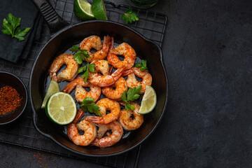 spicy roasted shrimps in cast iron pan - 528242606