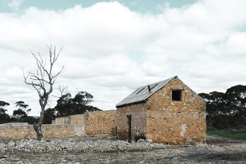 Fototapeta na wymiar Old stone house on an abundant farm 