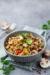 Warm pearl barley salad with mushrooms and vegetables