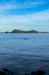 one of the traditional ways of catching fish in the midst of the glitter of modern times