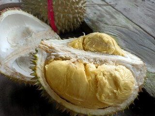 durian fruit With a soft and melted texture with a thorny skin.  durian fruit begraund wooden table