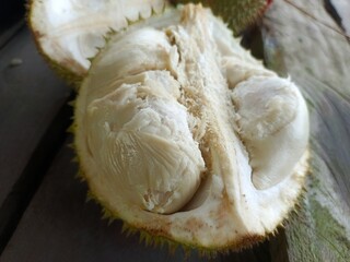 durian fruit With a soft and melted texture with a thorny skin.  durian fruit begraund wooden table