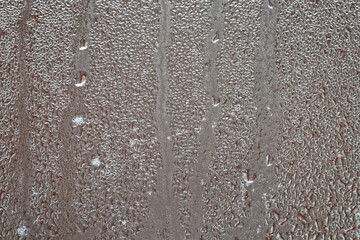 Raindrops and condensation on window, firsts frosts