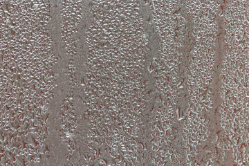 Raindrops and condensation on window, firsts frosts