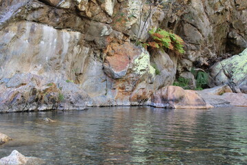 Stream with transparent water. Large Rocks surrounded by running water. Fragas de São Simão, river beach, Figueiró dos Vinhos Portugal