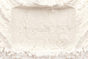 Background from wheat flour. Texture of flour with a free space in the form of a frame for the inscription