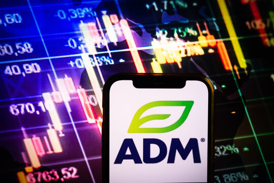 KONSKIE, POLAND - August 30, 2022: Smartphone displaying logo of ADM company on stock exchange chart background