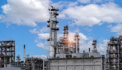 Industry Overview The refinery is an industrial area with sunrise and cloudy skies, oil and natural gas storage tanks, the refinery industry.