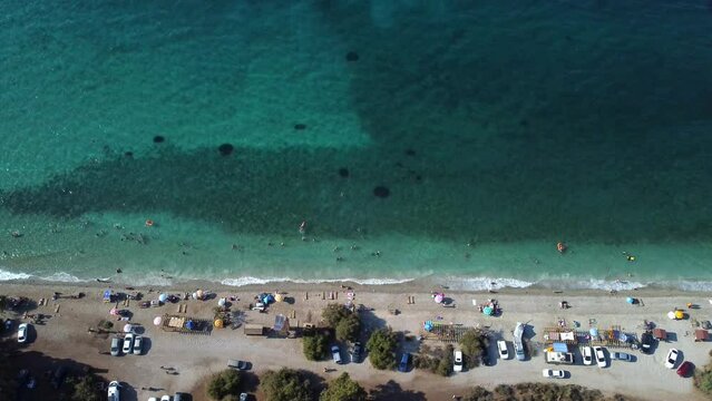 aerial view, sea and unofficial beach, with cars on the shore, azure sea, milli park near the city of Kusadasi