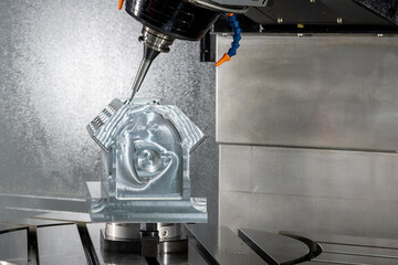 The 5-axis machining center cutting the V8 cylinder block with solid ball end mill tool.
