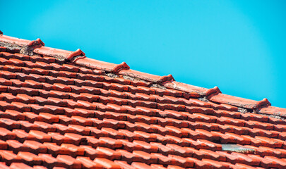 New roofing construction with roof windows and roof protection and blue sky.