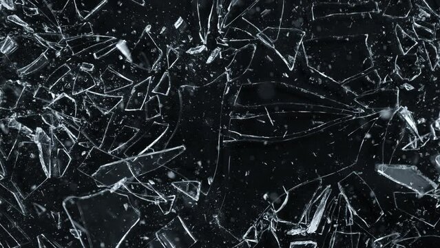Super Slow Motion Shot of Breaking Real Glass at 1000 fps. Isolated on Black Background.