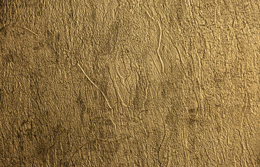 Bronze metal background. Brown background from decorative plaster with abstract spots. Unusual, creative surface background. Front covering for facing of buildings.