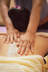 close-up masseur hands doing back massage in spa salon. Beauty treatment concept.