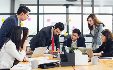Group of business asian and caucasian people wearing formal suits, talking, meeting and discussing their projects at office. Working and Teamwork Concept.