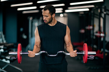 Portrait Of Athletic Black Man With Barbell In Hands Exercising At Gym