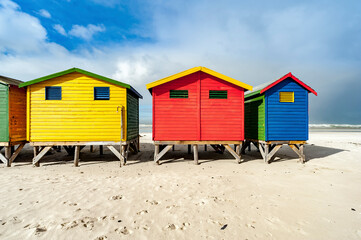Fototapeta na wymiar Colourful Victorian bathing boxes, Muizenberg Beach, Cape Town, South Africa