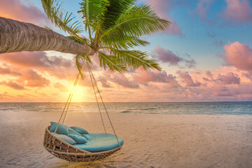 Tropical sunset beach background, summer island landscape with palm swing and sand sea sky beach. Beautiful couple beach vacation or summer holiday concept. Honeymoon, romance resort. Amazing scene