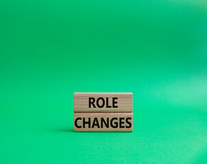 Role changes symbol. Concept words Role changes on wooden blocks. Beautiful green background. Business and Role changes concept. Copy space.