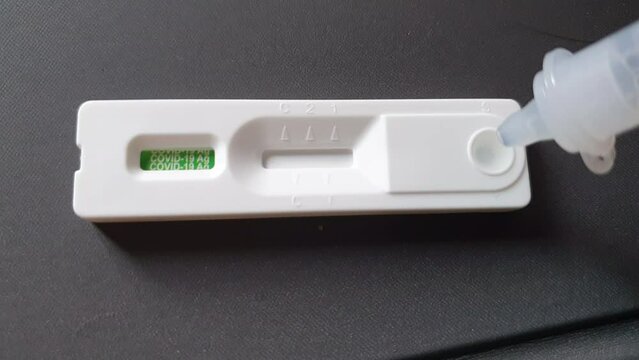 Covid-19 rapid antigen test kit ATK video showing result of clean negative result one red lines not infected