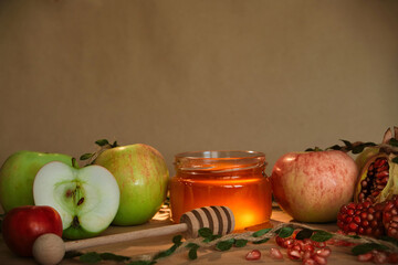 Apples, pomegranate and honey, the traditional food of the Jewish New Year - Rosh Hashana. Copy space background