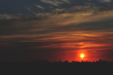 red crimson sunset on the skyline of the city landscape