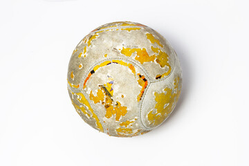 An old soccer ball whose skin has peeled off.