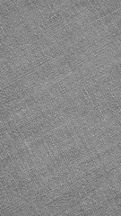 Fototapeta na wymiar Gray or black and white woven surface close up. Linen textile texture. Fabric handicraft vertical background. Textured braided grey backdrop. Len mobile phone wallpaper. Macro