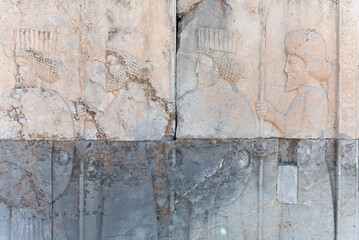 Bas-relief decoration along stairs from Darius palace to Palace of Xerxes. Ancient ruins of Persepolis near Shiraz in southern Iran. This UNESCO World Heritage Site showcases beautiful ruins from the 