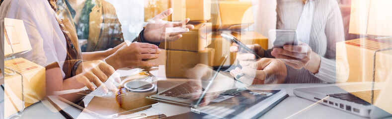 Startup small business entrepreneur or freelance Asian woman using a laptop with box, Young success Asian woman with her hand lift up, online marketing packaging box and delivery, SME concept.