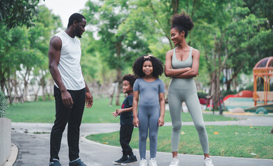 African children and families happily play outdoor sports in the garden.Man jogging with nature in the garden.On summer vacation, the family happily took a walk in nature.