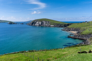 landscape view of the turquoise waters and golden sand beach at Slea Head on the Dingle Peninsula...