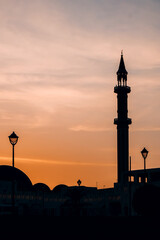 Silhouette of mosque on a sunset sky in Doha, Qatar