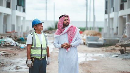 Arab Muslims are engaged in architecture business and are architects.Saudi manager organizes confidence meeting with partners. human achievement architecture construction site.