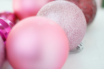 pink Christmas balls on a white table