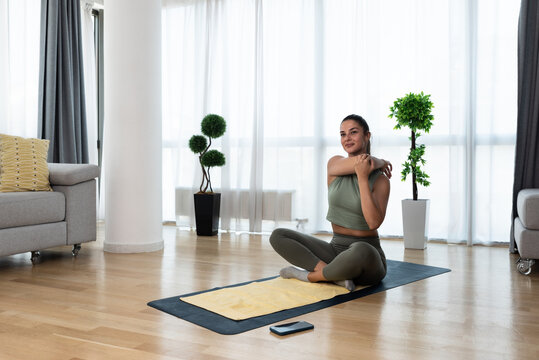 Young Woman Rehabilitation Exercise At Home After Car Crash Accident. Recovery Workout Of Young Girl With Yoga Training Poses For Stretching The Muscles. Female After Childbirth  Relaxing.