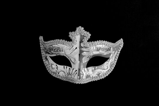 Venetian carnival masks on the gray background. Top view. Close-up.