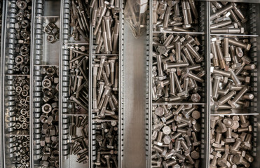 Top view of bolts and nuts that lie in their
boxes.