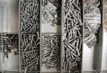 Top view of bolts and nuts that lie in their
boxes.