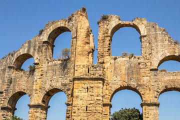 Aqueduct in Aspendos. Antalya. Ruin. An ancient Roman aqueduct that supplied Aspendos with water. Arched structure. 