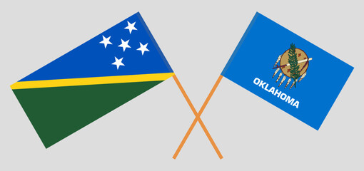 Crossed flags of Solomon Islands and The State of Oklahoma. Official colors. Correct proportion