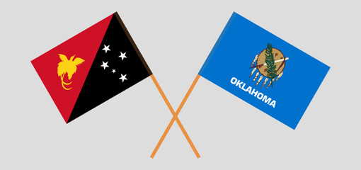 Crossed flags of Papua New Guinea and The State of Oklahoma. Official colors. Correct proportion