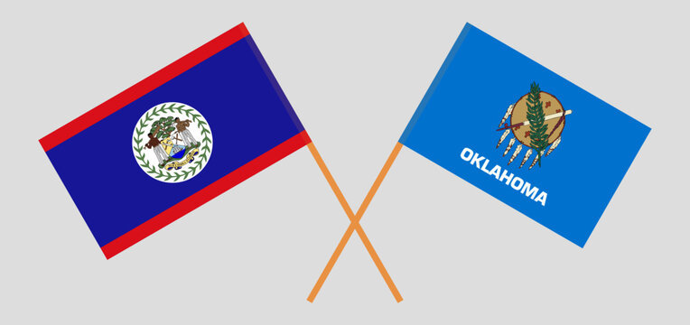 Crossed flags of Belize and The State of Oklahoma. Official colors. Correct proportion