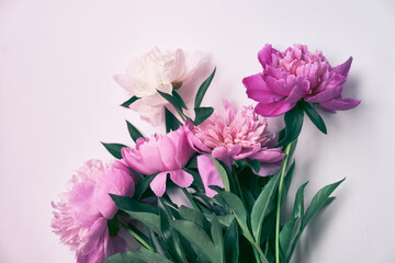 Top view of a beautiful bouquet of pink peonies on an isolated white background. Flower arrangement. Wallpaper, greeting card, poster, flower shop concept. High quality photo