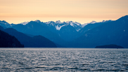 The mountains that can be seen across Pitt Lake, British Columbia during golden hour and sunset.