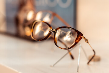 Close-up, designer glasses inside a shop optic window