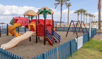 Children playground by the sea. Children's vacation at sea. Play area.