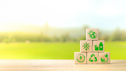 wooden cubes with eco globe on Blurred nature background, Internet of things, Smart technology with agriculture concept, Sustainable energy, Metaverse, AI Futuristic Smart virtual interface.