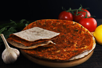 Lahmajoun - a minced meat dish on a flatbread. Shallow depth of field