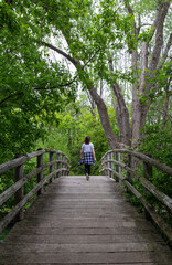 Woman alone on foot bridge
